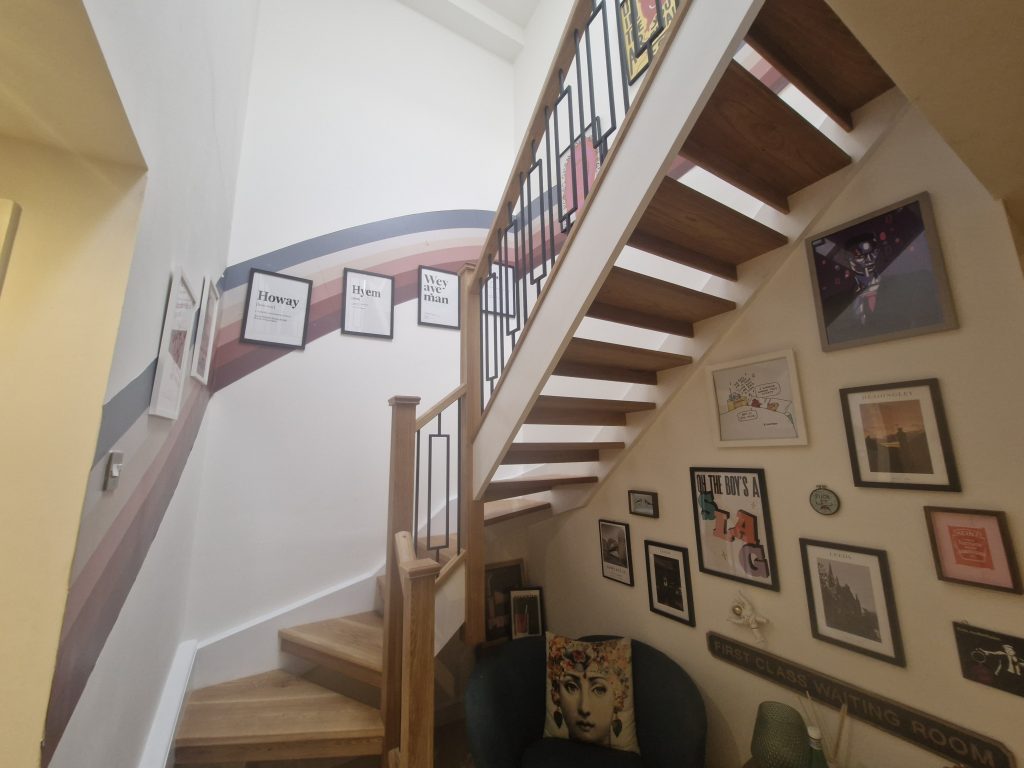 Oak staircase refurbishment with timber newels, handrails and metal balustrade